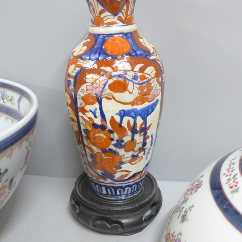 812 - Two large porcelain punch bowls, restored, an Imari vase and an Imari bowl on stand **PLEASE NOTE TH... 