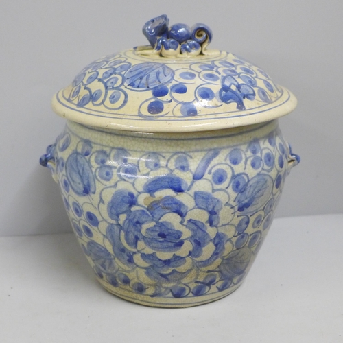 815 - An oriental blue and white hand painted lidded pot, 18cm