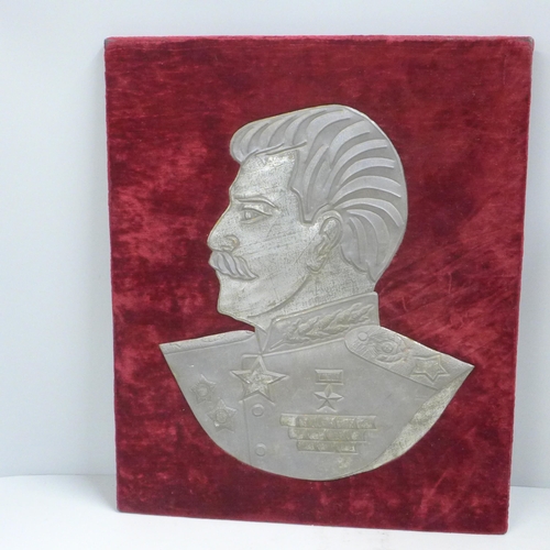 821 - A mounted tin plate profile portrait of Joseph Staliln