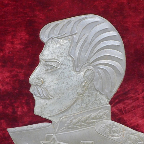 821 - A mounted tin plate profile portrait of Joseph Staliln