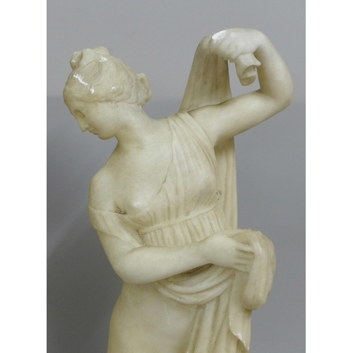 828 - An alabaster figure of the Goddess Venus Aphrodite, plinth restored, 50cm