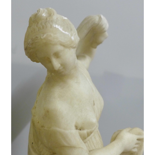 828 - An alabaster figure of the Goddess Venus Aphrodite, plinth restored, 50cm