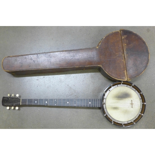 832 - A late 19th Century banjo, marked 'Unwarpable, patent no. 23974 Rd. 294951', with inlaid case and le... 