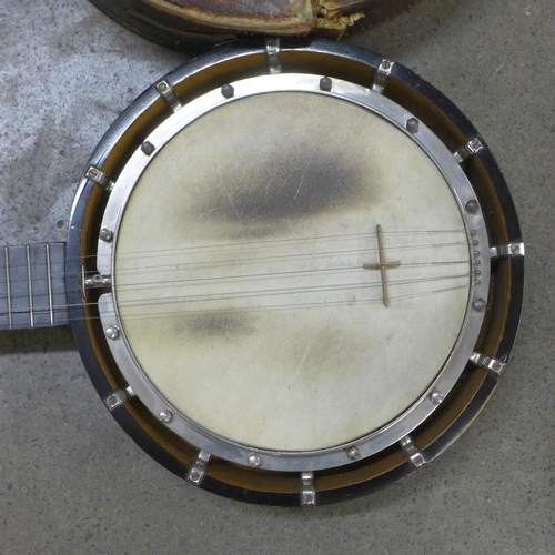 832 - A late 19th Century banjo, marked 'Unwarpable, patent no. 23974 Rd. 294951', with inlaid case and le... 