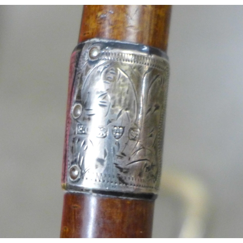 834 - Two walking sticks with silver collars, one with horn handle