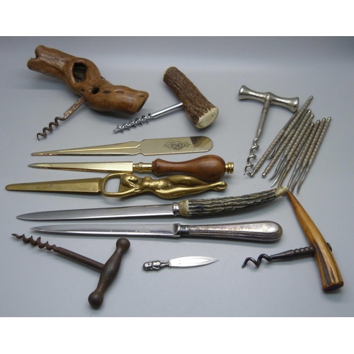 887 - A collection of corkscrews, paper knives, implements, etc.