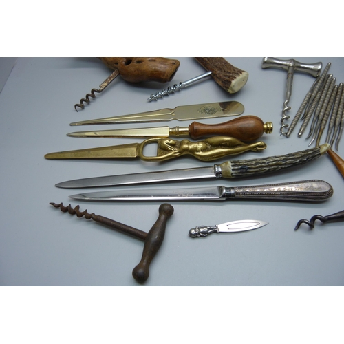 887 - A collection of corkscrews, paper knives, implements, etc.