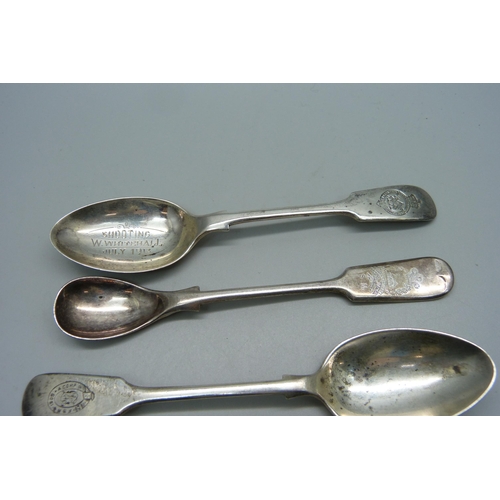 891 - Four silver spoons including three with The Queens 24th Battalion County of London Regiment emblem, ... 