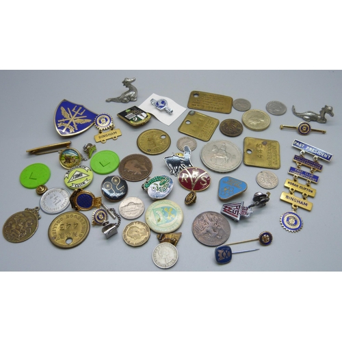 893 - A collection of tokens, pin badges and coins