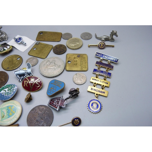 893 - A collection of tokens, pin badges and coins