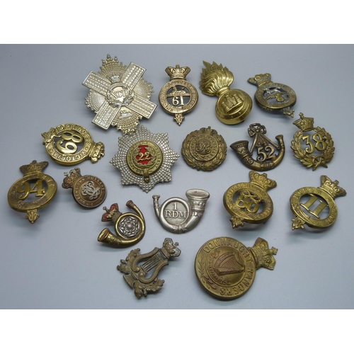 898 - A collection of 19th Century British Army regiment cap badges