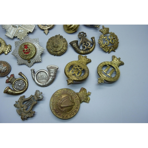 898 - A collection of 19th Century British Army regiment cap badges