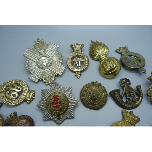 898 - A collection of 19th Century British Army regiment cap badges