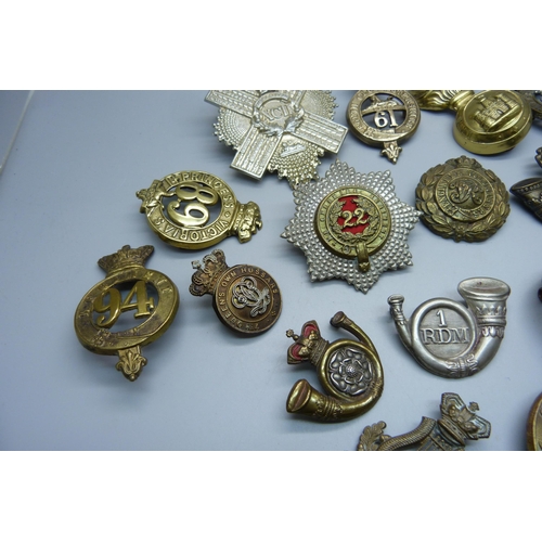 898 - A collection of 19th Century British Army regiment cap badges