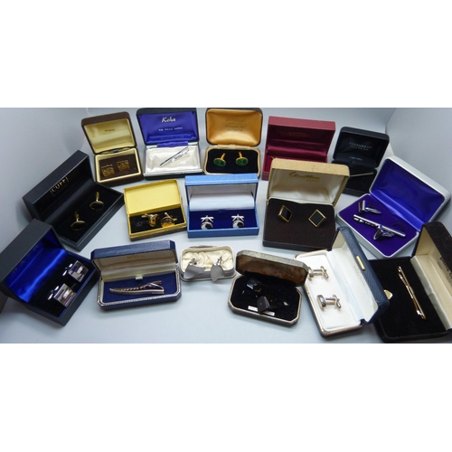 938 - A collection of cufflinks and tie-pins, boxed