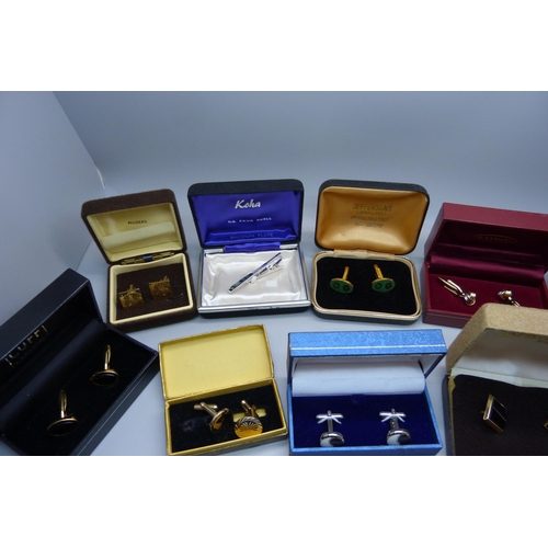 938 - A collection of cufflinks and tie-pins, boxed