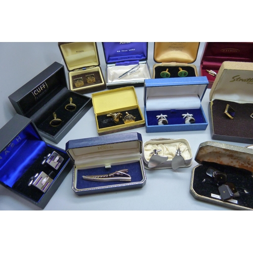 938 - A collection of cufflinks and tie-pins, boxed