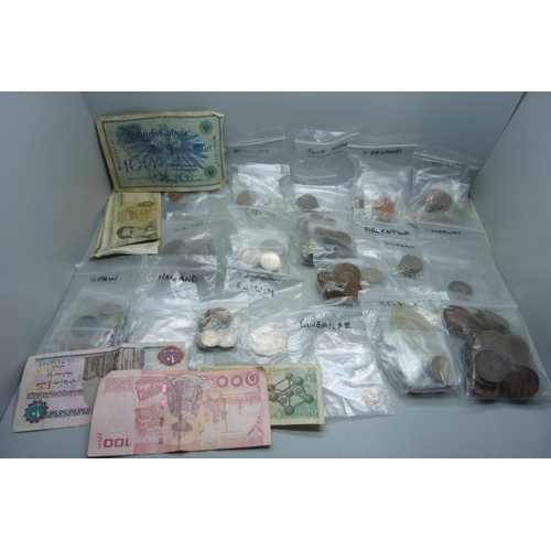 939 - A box of British and foreign coins and bank notes