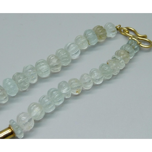 946 - A crystal necklace with an 18ct gold hook fastener, 44cm