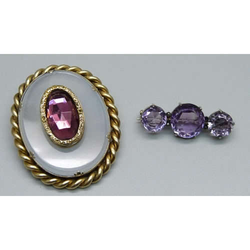 957 - A brooch set with three amethysts and seed pearls and one other brooch, (lacking one seed pearl)