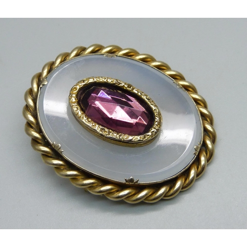 957 - A brooch set with three amethysts and seed pearls and one other brooch, (lacking one seed pearl)