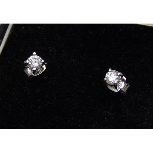 958 - A diamond stud earrings, approximately 0.50ct diamond weight