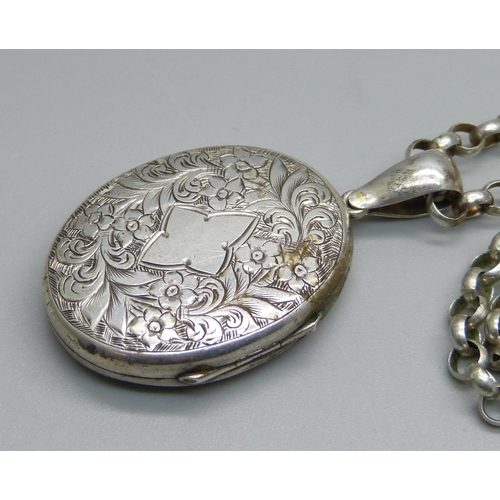 960 - A locket on a silver chain, chain 74cm