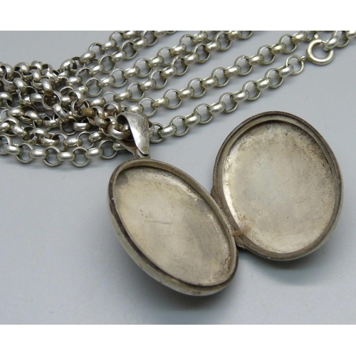 960 - A locket on a silver chain, chain 74cm