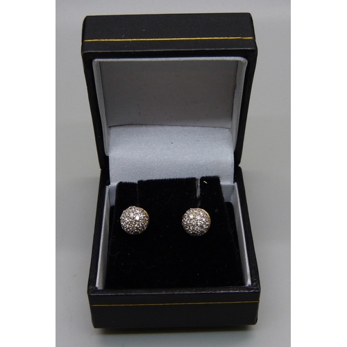 964 - A pair of pave set diamond ear studs, marked 850, test as 18ct gold, 3.5g