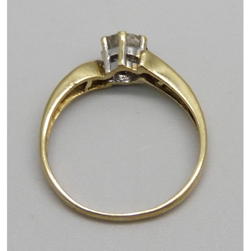 968 - An 18ct gold and diamond solitaire ring with diamond shoulders, approximately 0.60ct diamond weight,... 