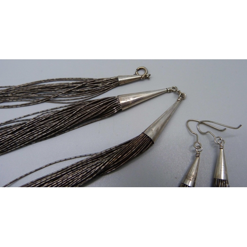 977 - A silver necklace, bracelet and earrings set, 60g