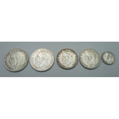 979 - A 1925 sixpence, two half crowns, 1929 and 1934 and two florins, 1931 and 1936