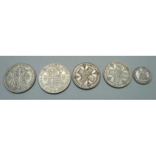 979 - A 1925 sixpence, two half crowns, 1929 and 1934 and two florins, 1931 and 1936