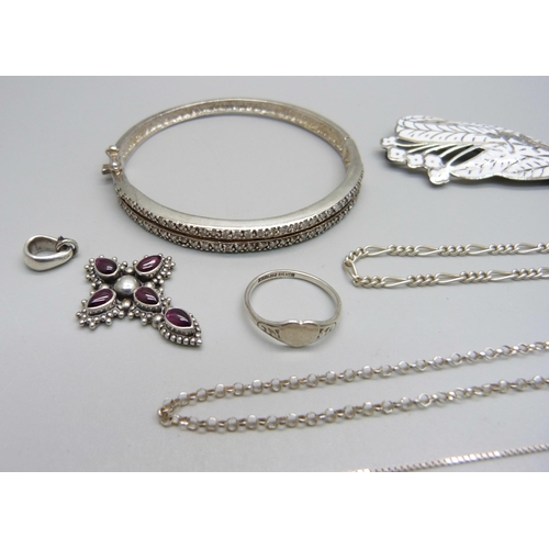 986 - Three silver necklaces, two silver bracelets, a silver brooch and ring, a silver bangle (one stone m... 