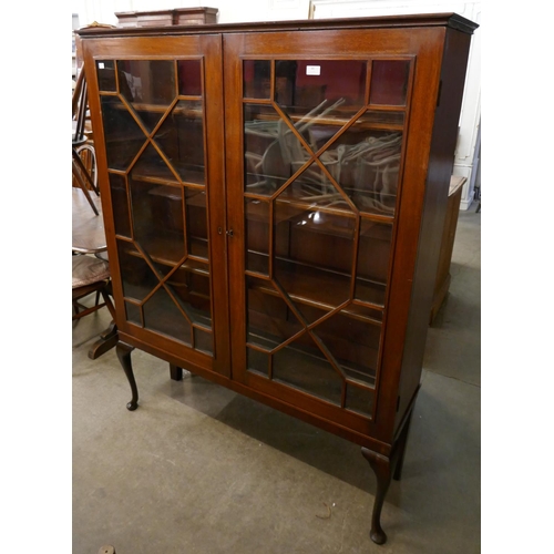 173 - An Edward VII mahogany two door bookcase