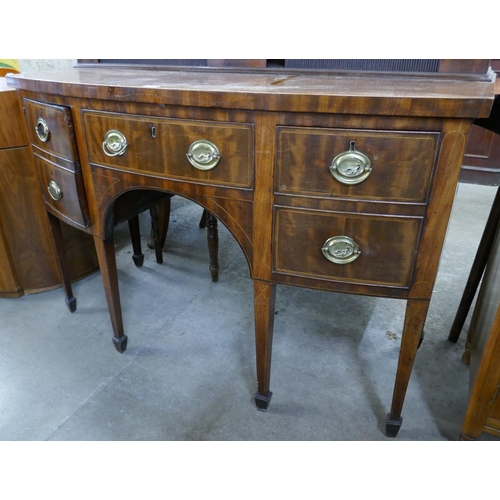 202 - A George III mahogany bow front sideboard