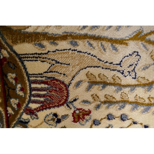 1447 - An ivory ground Cashmere carpet, traditional tree of life design, 200cm x 300cm