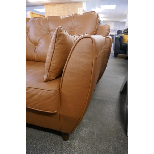 1461 - A tan leather Hoxton love seat, RRP £1539