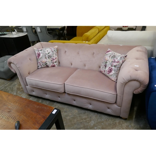 1476 - A pink velvet Chesterfield sofa, RRP £1699