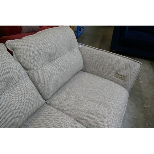 1509 - An oatmeal upholstered electric reclining two seater sofa
