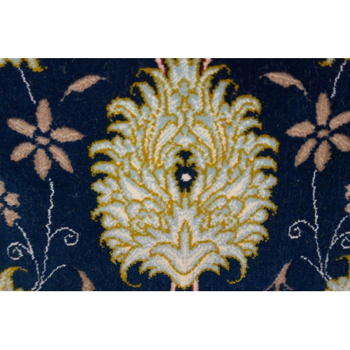 1519 - A fine woven Iranian carpet, floral embossed pattern with hints of duck egg blue, 300cm x 200cm