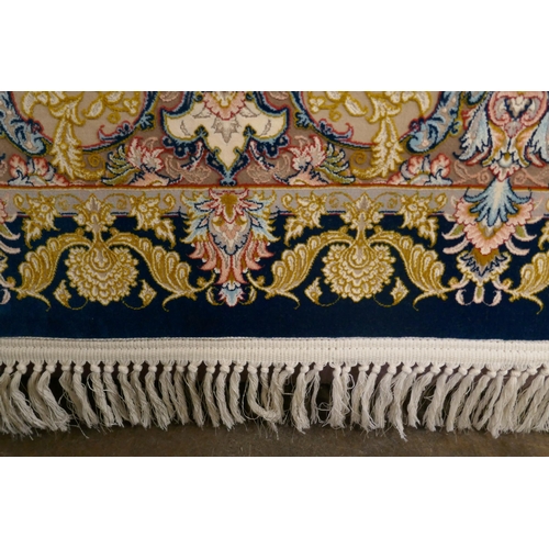 1519 - A fine woven Iranian carpet, floral embossed pattern with hints of duck egg blue, 300cm x 200cm