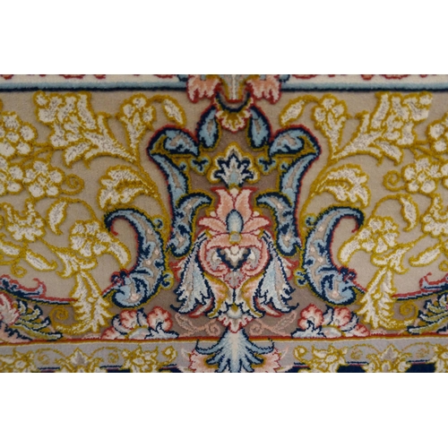 1519 - A fine woven Iranian carpet, floral embossed pattern with hints of duck egg blue, 300cm x 200cm