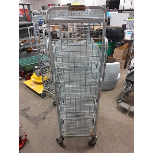 2247 - A stainless steel 4 wheeled, 5 tiered catering trolley