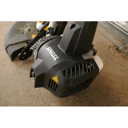 2215 - A petrol driven Titan TT5MTP26-2 multi tool with multiple attachments including hedge cutter, chains... 