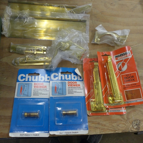 2322 - Two boxes of assorted ironmongery, mostly brass door fittings