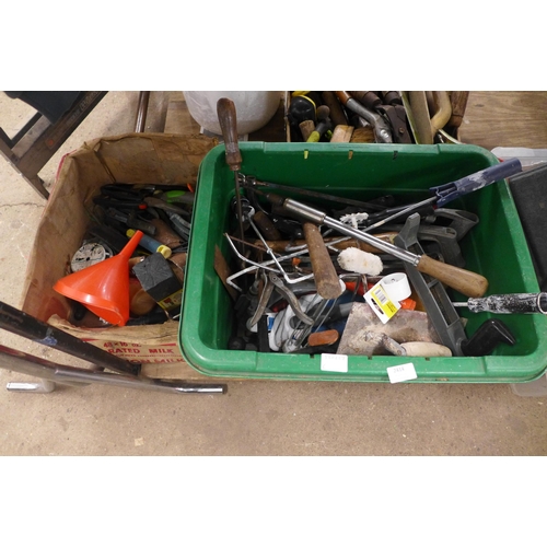 2414 - A large quantity of mixed garden tools including shears, pruning saw, trowels, forks, ear defenders ... 