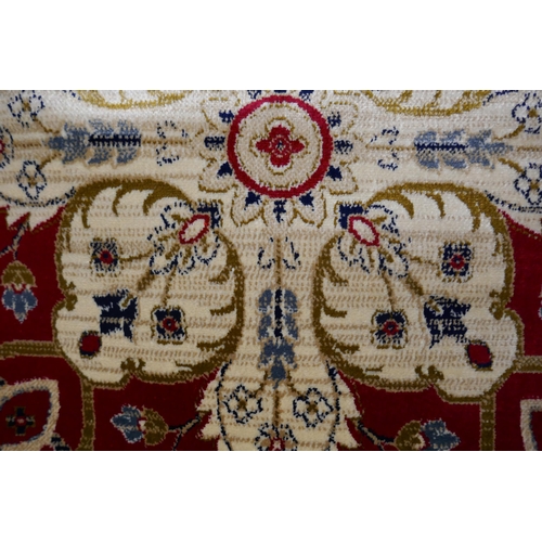 1549 - A rich red ground Cashmere carpet, full pile, floral medallion design, 200cm x 300cm