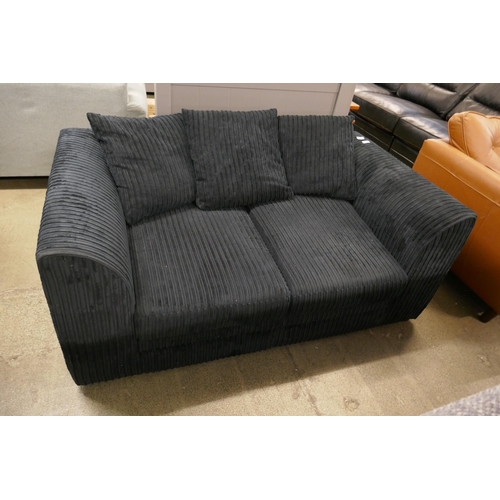 1590 - A black jumbo cord two seater sofa