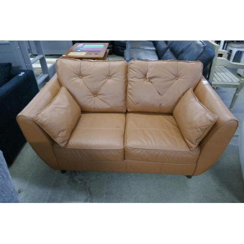 1591 - A tan leather Hoxton love seat (damaged)